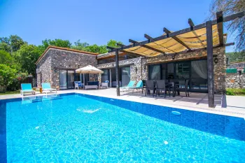 Красивый каменный дом-бунгало в Каякёй Фетхие